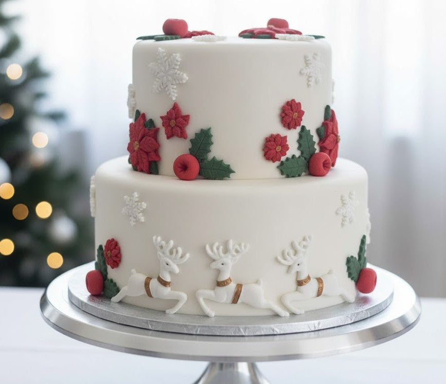 Christmas cake decorated with edible fondant reindeer poinsettias holly leaves berries and snowflakes