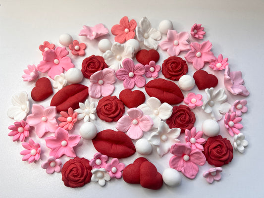 fondant lips, roses and other assorted flowers for cake decorating. 

