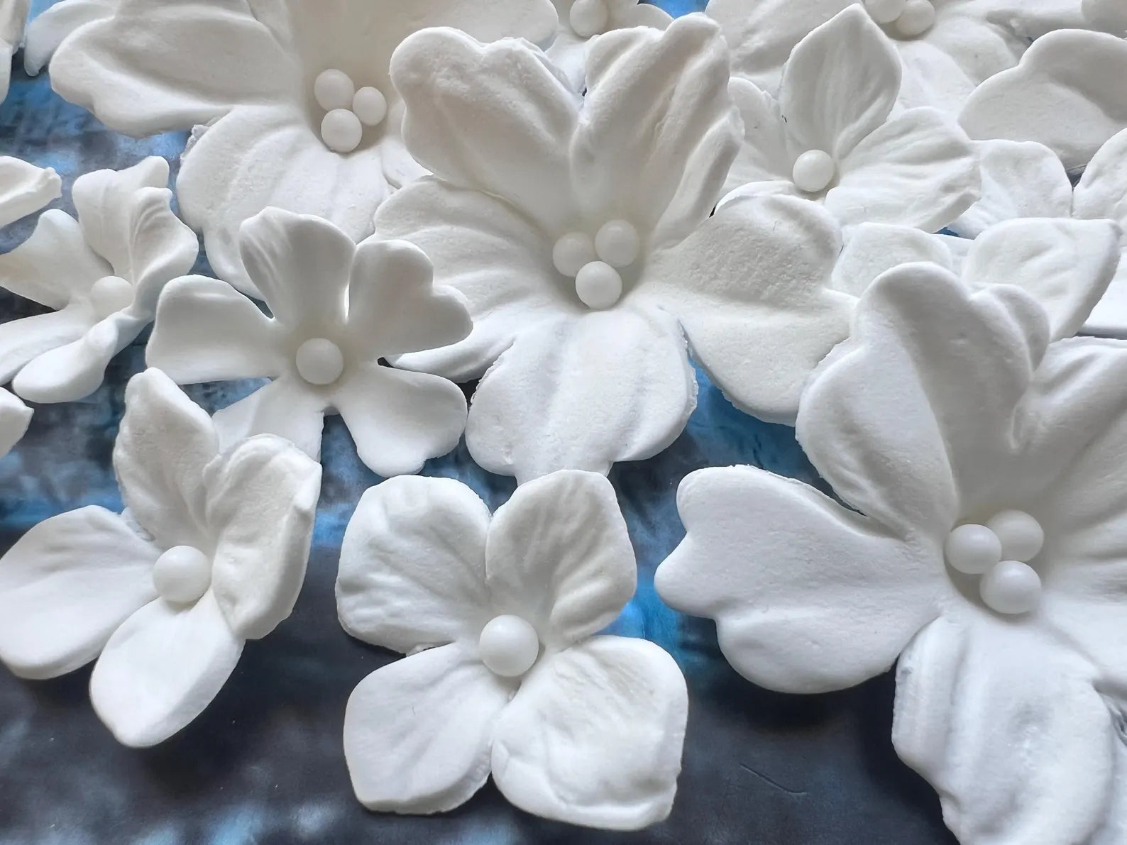 Macro view of handmade white edible sugar flowers