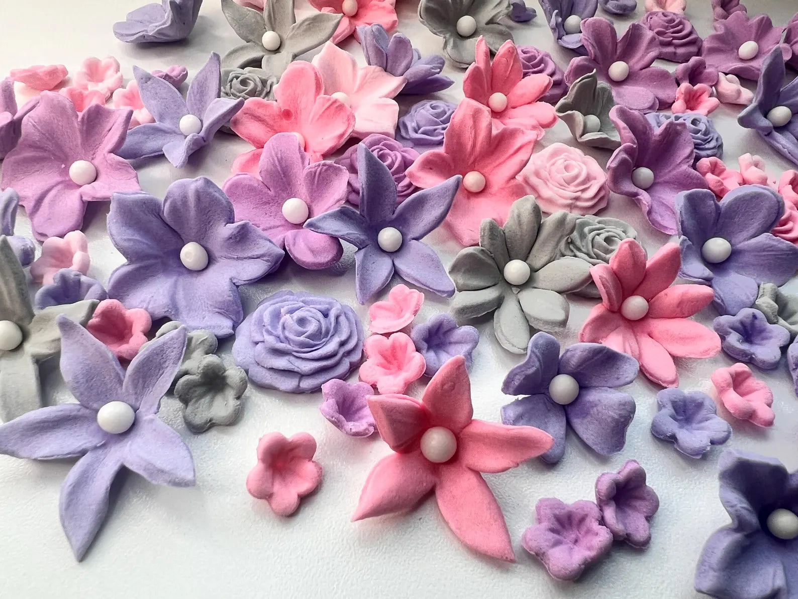 Handmade pastel edible fondant flowers close up