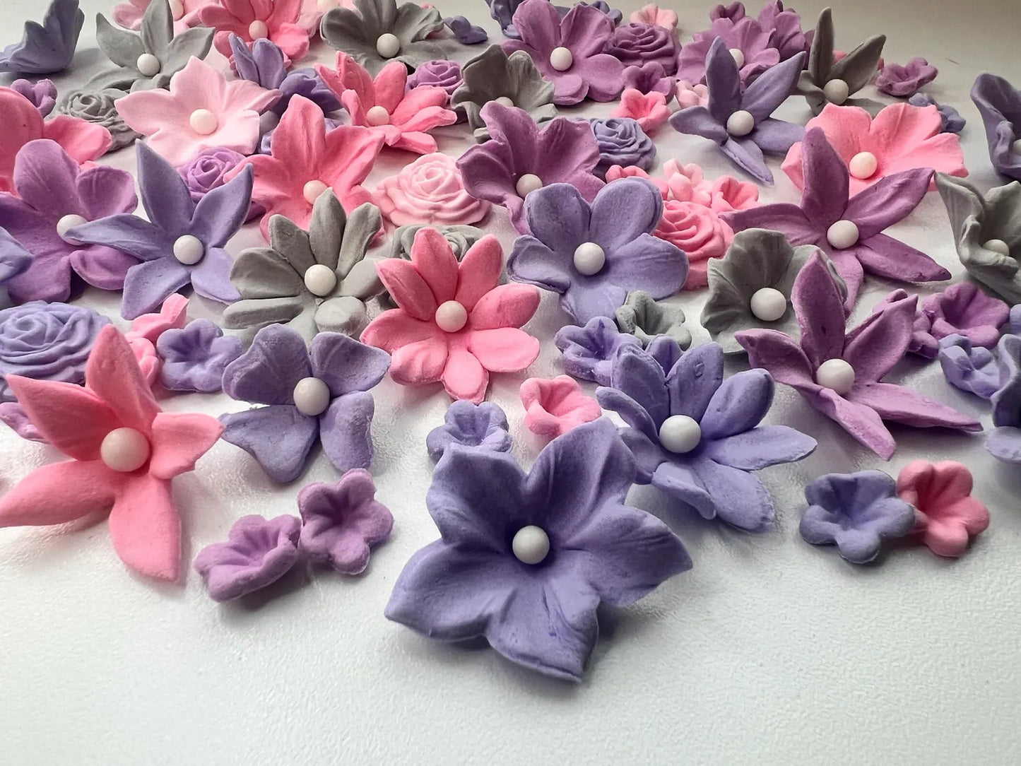 Soft pink purple and grey fondant flowers detailed view